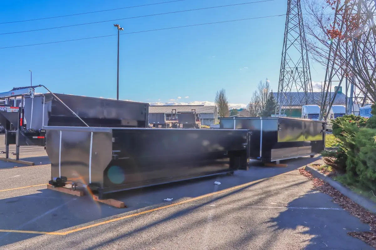 Roll-off dumpster ready for waste disposal at job site for 3 Yard Dumpster Rental in Alma